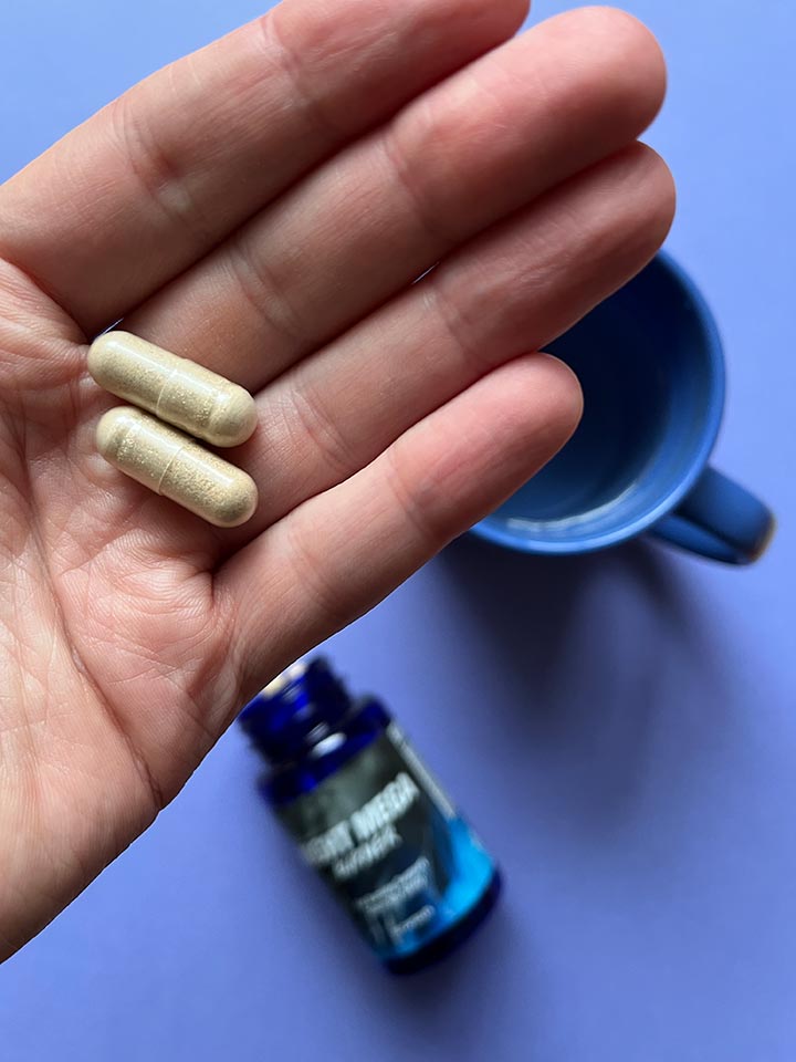 Real photo of Night Mega Burner supplement bottle held by a user